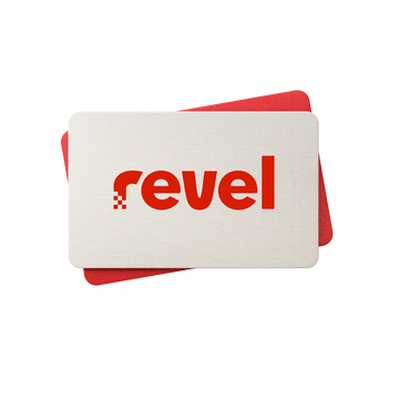 Two rectangular cards overlap on a white background. The top card is beige, featuring “Revel”—the brand name of the Digital gift card—in bold red lowercase letters, inviting you to experience the gift of grip. The solid red bottom card is slightly offset and partially visible behind the beige one.