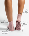 Wearing The Wildcat Grip Sock by Revel Athletic in pink with leopard embroidery, this person enjoys washer & dryer safe construction, compression arch support, a perfect midi length, and full heel-to-toe grip coverage. Featuring a non-slip grid pattern on the sole, these Pilates essentials blend stylish design with practical performance.