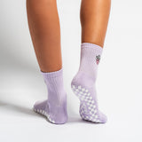 Lavender Austin grip socks with a cowboy-hat smiley face embroidery and a white non-slip traction sole