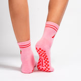 Pink Miami grip socks with red stripes, chili pepper embroidery, and a red non-slip traction sole