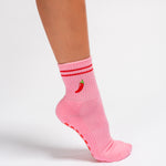 Pink Miami grip socks with red stripes, chili pepper embroidery, and a red non-slip traction sole