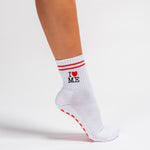 White New York grip socks with red stripes, an "I heart ME" graphic, and a red non-slip patented grip sole