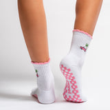 White Los Angeles grip socks with a pink scalloped cuff, pink convertible and palm-tree embroidery, and a pink non-slip patented grip sole