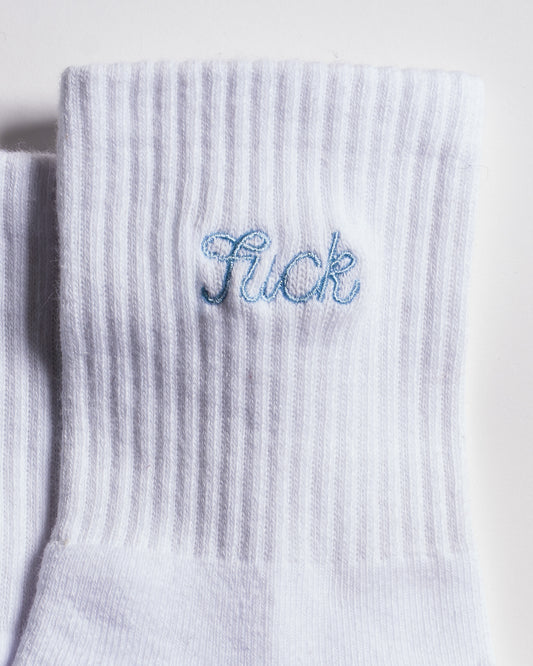 The Pardon My French Grip Sock (Baby Blue) by Revel Athletic features a white ribbed design with “Sick” embroidered in light blue near the cuff, making it perfect as Pilates or barre grip socks for your next studio session.
