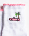 White Los Angeles grip socks with a pink scalloped cuff, pink convertible and palm-tree embroidery, and a pink non-slip patented grip sole
