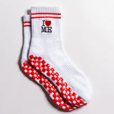 White New York grip socks with red stripes, an "I heart ME" graphic, and a red non-slip patented grip sole