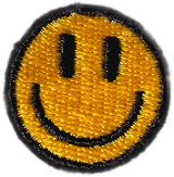 A yellow embroidered patch in the shape of a classic smiley face with black eyes and a black curved mouth, outlined in black, on a light background—perfect for adding cheerful style to your favorite pair of grippy socks, pilates socks, or barre socks.
